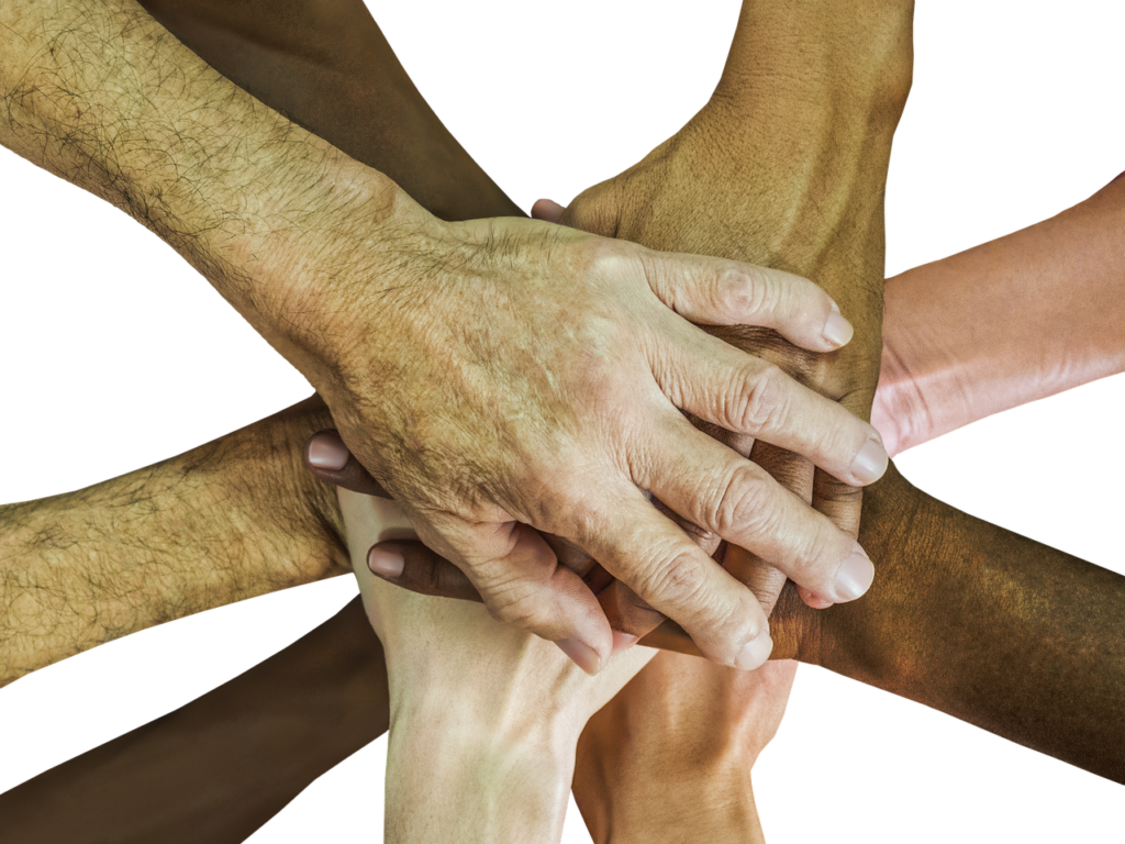 Stacked hands symbolize a united team effort involving dog owners, their families, and trainers, working together for positive behavior change.