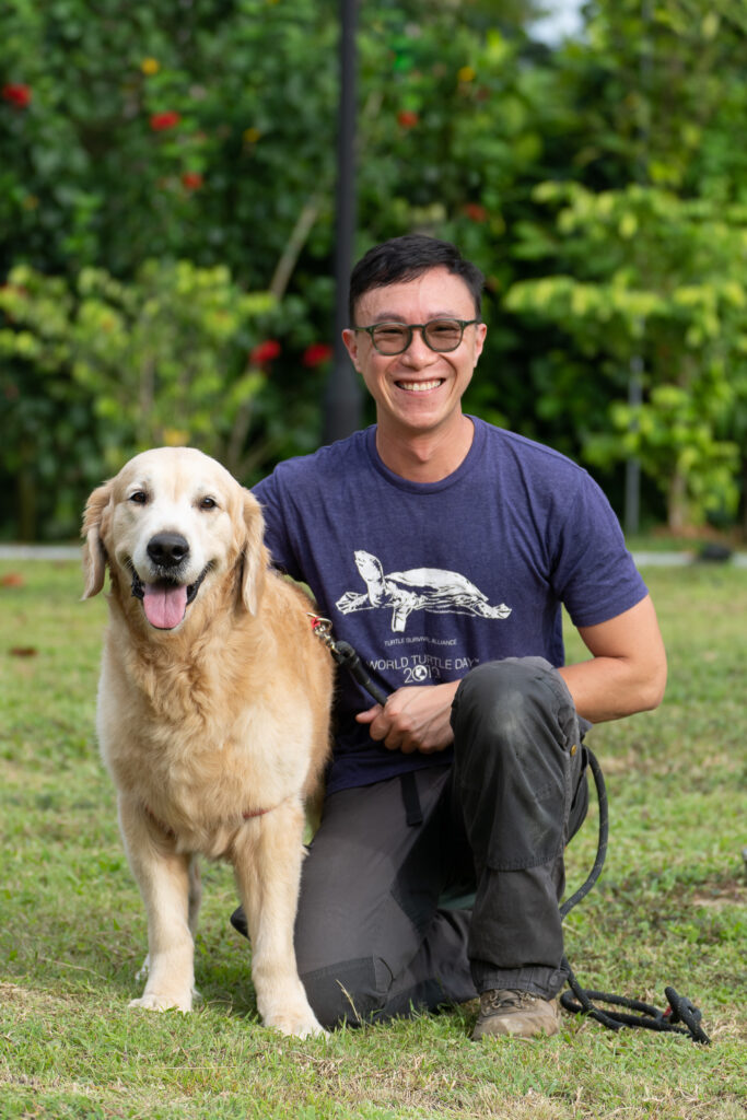 Head Coach Webster from Pet Coach Singapore at a positive reinforcement dog training session with a golden retriever